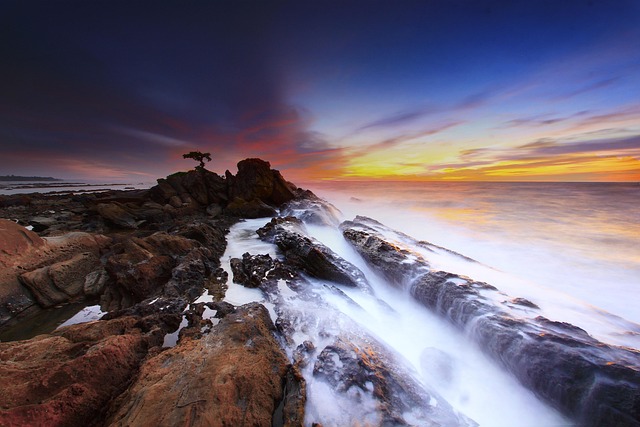 Rugged coastline with waves crashing against cliffs.